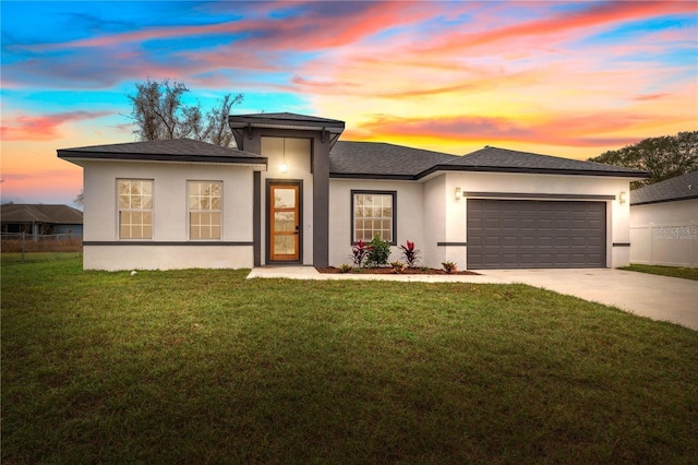 4450 SW 169th Pl, Ocala, FL 34473 - prairie-style home featuring a garage, stucco siding, concrete driveway, and a front yard
