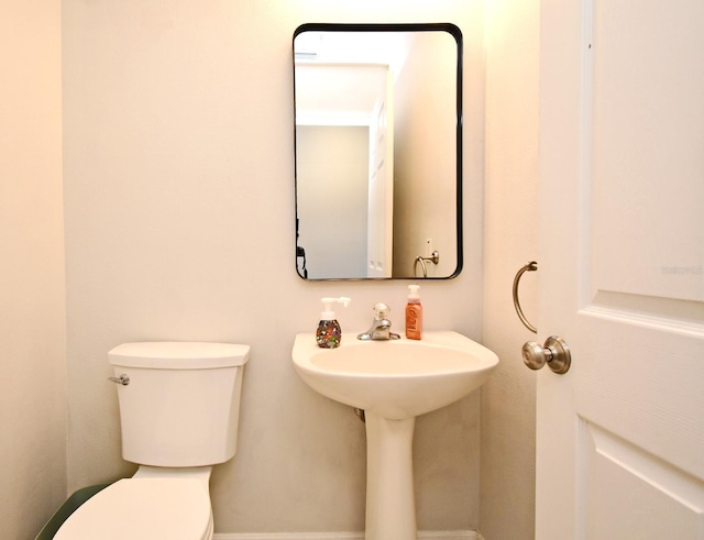 bathroom featuring toilet