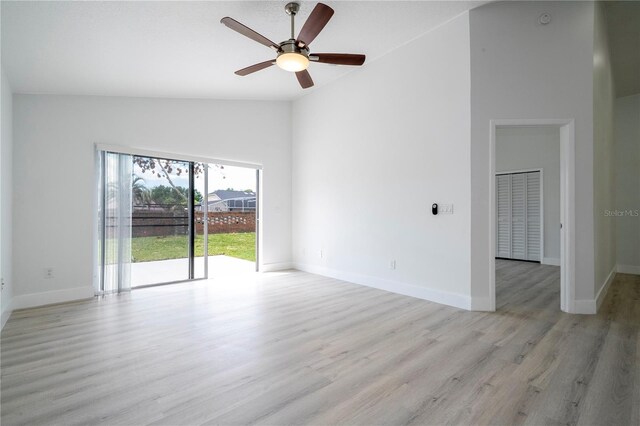 2218 Newt St, Orlando, FL 32837 - unfurnished room with baseboards, high vaulted ceiling, ceiling fan, and light wood finished floors