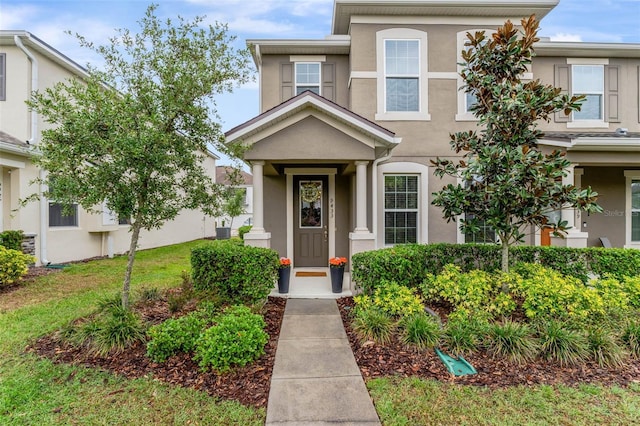 9433 Randal Park Blvd, Orlando, FL 32832 - view of front of home featuring central AC unit and stucco siding