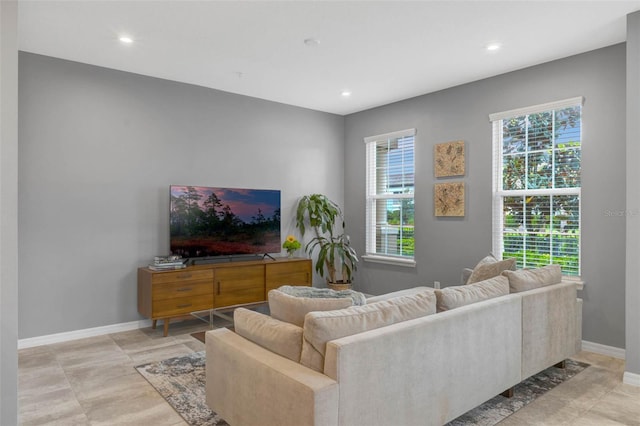 9433 Randal Park Blvd, Orlando, FL 32832 - living area with recessed lighting and baseboards