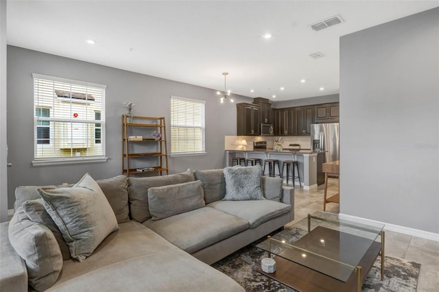 9433 Randal Park Blvd, Orlando, FL 32832 - living area featuring visible vents, baseboards, and recessed lighting