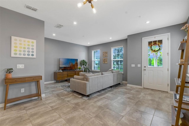 9433 Randal Park Blvd, Orlando, FL 32832 - living area with visible vents, baseboards, and recessed lighting