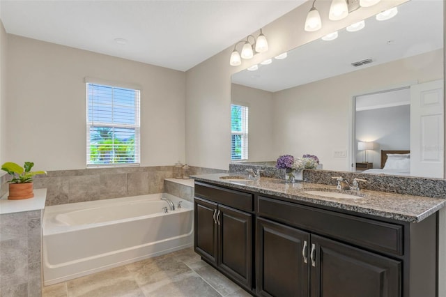 9433 Randal Park Blvd, Orlando, FL 32832 - ensuite bathroom with a garden tub, double vanity, ensuite bathroom, and a sink