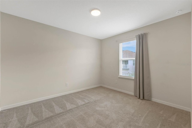 9433 Randal Park Blvd, Orlando, FL 32832 - spare room with baseboards and light colored carpet