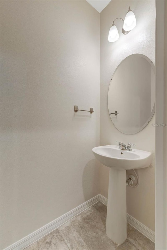 9433 Randal Park Blvd, Orlando, FL 32832 - bathroom with baseboards and a sink