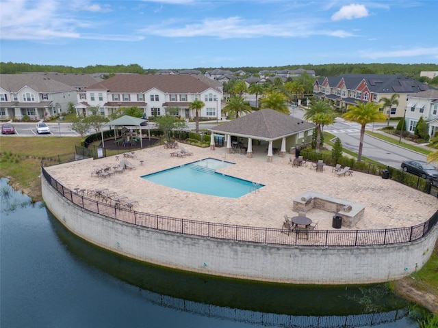 9433 Randal Park Blvd, Orlando, FL 32832 - community pool featuring a gazebo, fence, a patio, and a residential view
