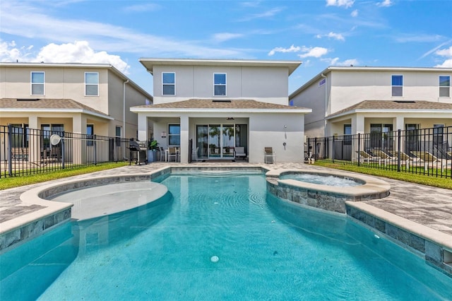 7759 Westland Dr, Kissimmee, FL 34747 - view of swimming pool with fence and a pool with connected hot tub