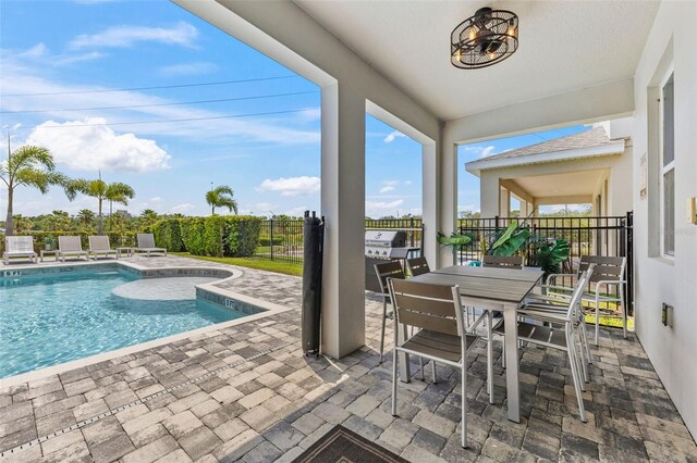 7759 Westland Dr, Kissimmee, FL 34747 - view of swimming pool featuring outdoor dining area, fence, a patio, a fenced in pool, and area for grilling