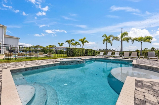 7759 Westland Dr, Kissimmee, FL 34747 - view of swimming pool featuring a pool with connected hot tub, a patio area, and fence