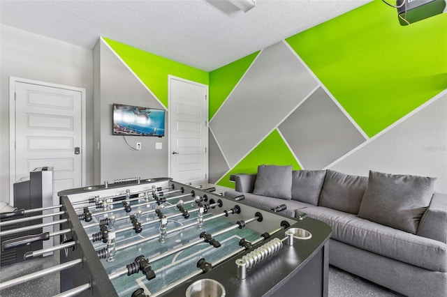 7759 Westland Dr, Kissimmee, FL 34747 - playroom with a textured ceiling