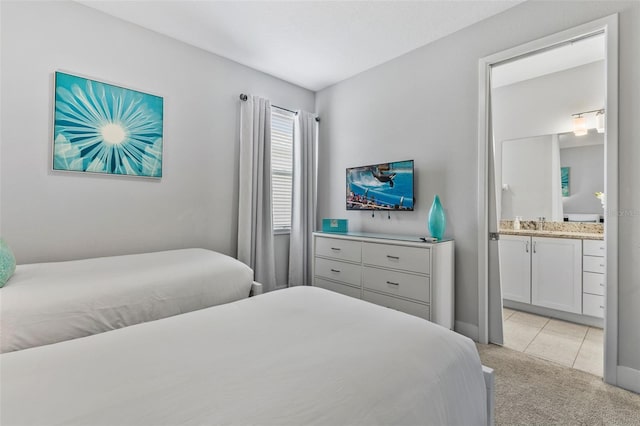 7759 Westland Dr, Kissimmee, FL 34747 - bedroom with light colored carpet, ensuite bath, and light tile patterned floors