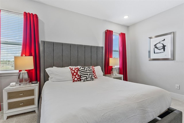 7759 Westland Dr, Kissimmee, FL 34747 - carpeted bedroom featuring baseboards and multiple windows