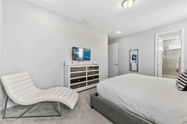 7759 Westland Dr, Kissimmee, FL 34747 - carpeted bedroom featuring visible vents, connected bathroom, and recessed lighting