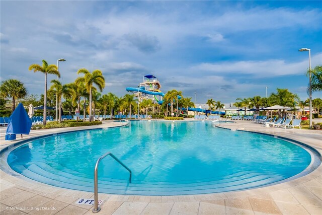 7759 Westland Dr, Kissimmee, FL 34747 - pool featuring a water slide and a patio
