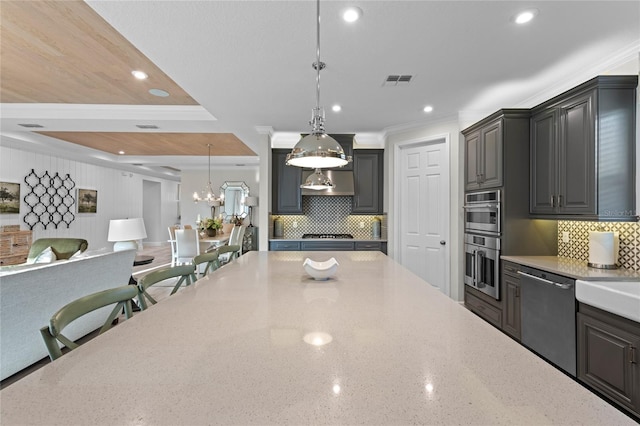 kitchen featuring visible vents, light stone countertops, open floor plan, appliances with stainless steel finishes, and backsplash