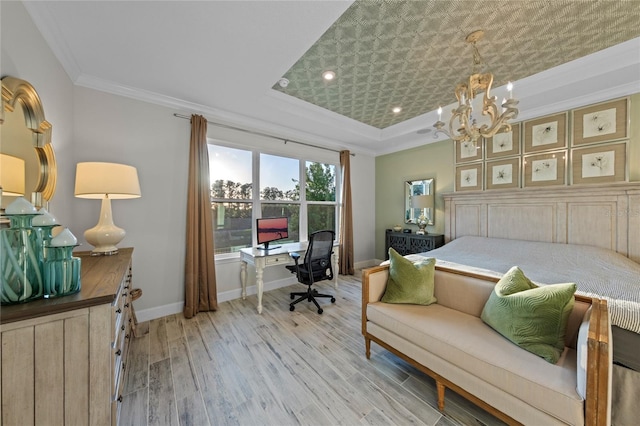 bedroom featuring crown molding, a raised ceiling, baseboards, a notable chandelier, and light wood-style floors