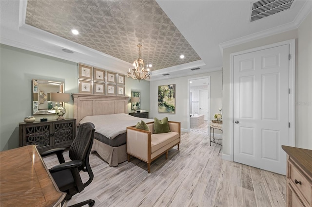 bedroom with visible vents, crown molding, a raised ceiling, light wood finished floors, and a chandelier