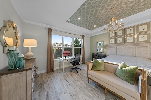 bedroom with crown molding, baseboards, a tray ceiling, light wood finished floors, and a notable chandelier