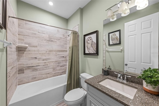 full bathroom featuring an inviting chandelier, vanity, toilet, and shower / tub combo