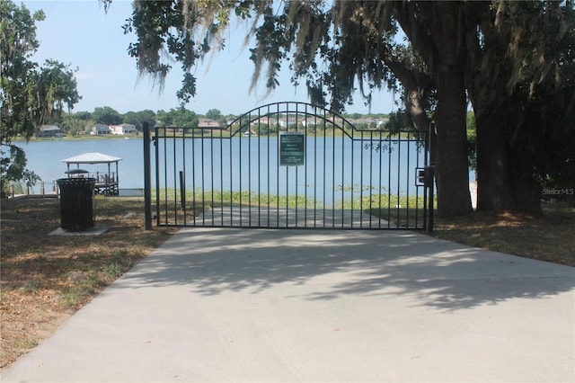 view of gate featuring a water view