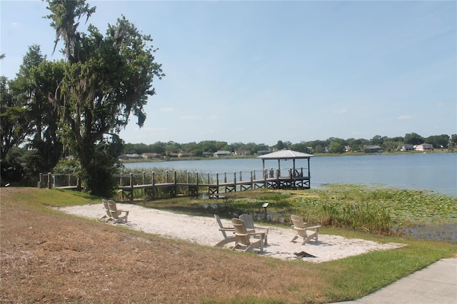 view of dock featuring a water view and a gazebo