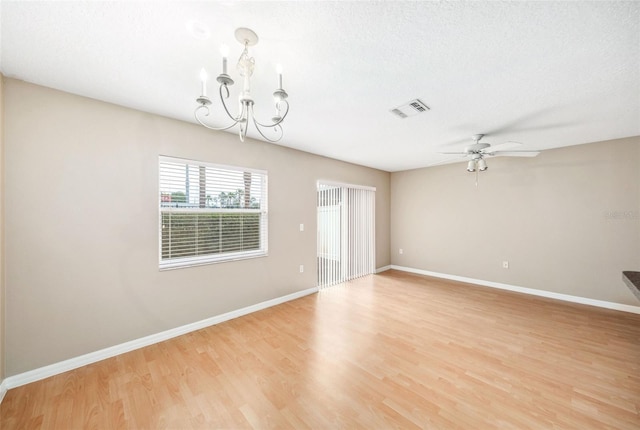 5004 Ashford Falls Ln, Oviedo, FL 32765 - spare room with a chandelier, light wood-style flooring, a ceiling fan, and baseboards