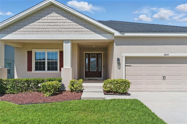 5829 Valentino Way, Lakeland, FL 33812 - exterior space featuring an attached garage, stucco siding, and driveway