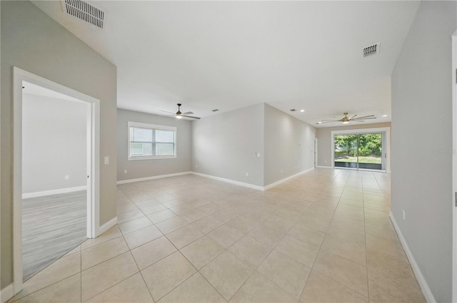 5829 Valentino Way, Lakeland, FL 33812 - unfurnished room with visible vents, ceiling fan, and light tile patterned flooring