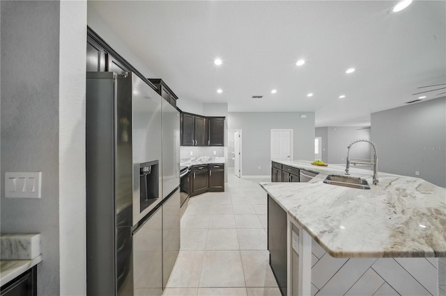 5829 Valentino Way, Lakeland, FL 33812 - kitchen with recessed lighting, light stone countertops, appliances with stainless steel finishes, and a sink