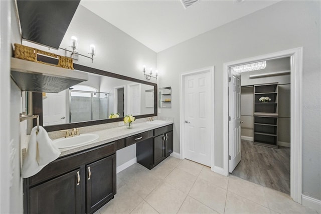 5829 Valentino Way, Lakeland, FL 33812 - full bathroom featuring double vanity, a sink, a stall shower, and visible vents