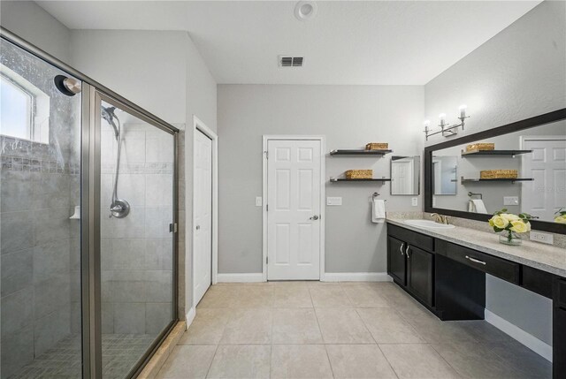 5829 Valentino Way, Lakeland, FL 33812 - bathroom featuring visible vents, a shower stall, vanity, tile patterned floors, and baseboards
