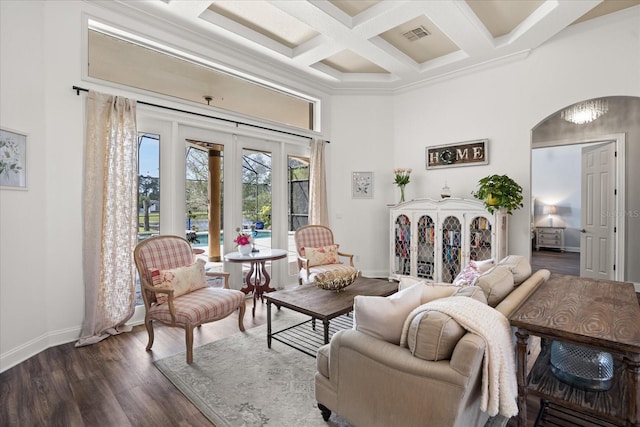 10664 Emerald Chase Dr, Orlando, FL 32836 - living area with dark wood-type flooring, arched walkways, a towering ceiling, coffered ceiling, and french doors