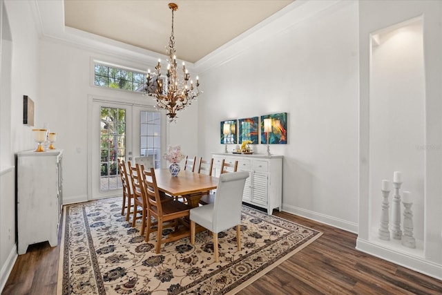 10664 Emerald Chase Dr, Orlando, FL 32836 - dining space featuring dark wood-style floors, baseboards, and an inviting chandelier