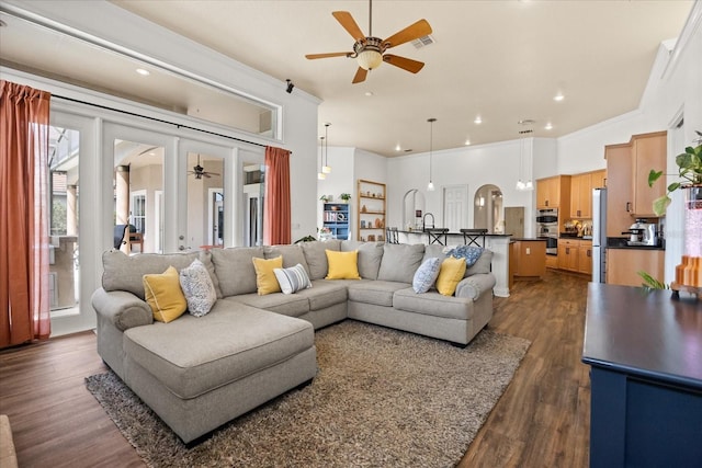 10664 Emerald Chase Dr, Orlando, FL 32836 - living area featuring dark wood-style floors, visible vents, ornamental molding, and ceiling fan