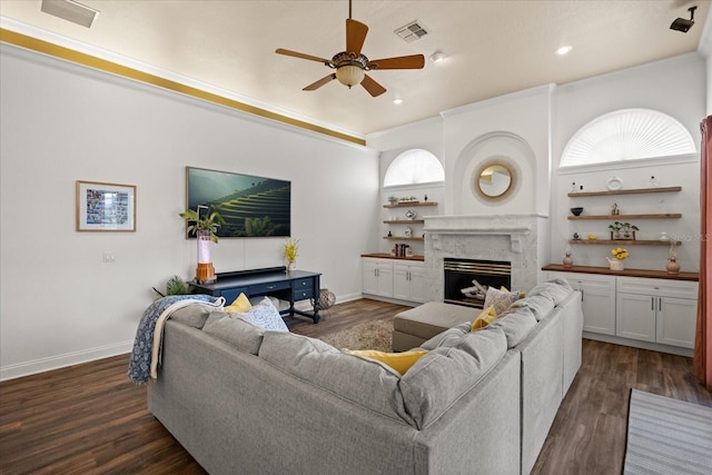 10664 Emerald Chase Dr, Orlando, FL 32836 - living area with dark wood-type flooring, baseboards, a ceiling fan, and visible vents