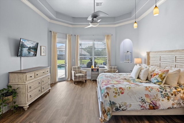 10664 Emerald Chase Dr, Orlando, FL 32836 - bedroom with ceiling fan, visible vents, access to exterior, wood finished floors, and a raised ceiling