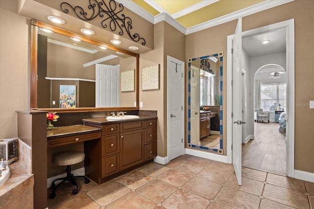 10664 Emerald Chase Dr, Orlando, FL 32836 - full bathroom featuring vanity, baseboards, tile patterned flooring, crown molding, and connected bathroom