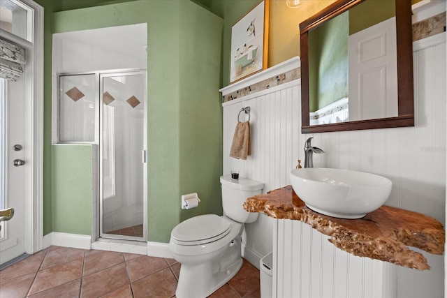 10664 Emerald Chase Dr, Orlando, FL 32836 - bathroom featuring tile patterned floors, toilet, radiator heating unit, a shower stall, and a sink