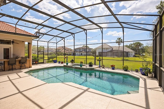 10664 Emerald Chase Dr, Orlando, FL 32836 - view of pool featuring outdoor dry bar, a patio, a lawn, and a lanai