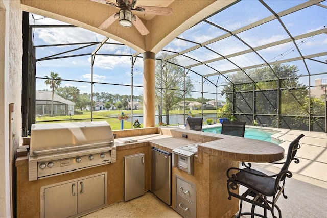 10664 Emerald Chase Dr, Orlando, FL 32836 - view of patio / terrace with a lanai, a grill, and an outdoor kitchen
