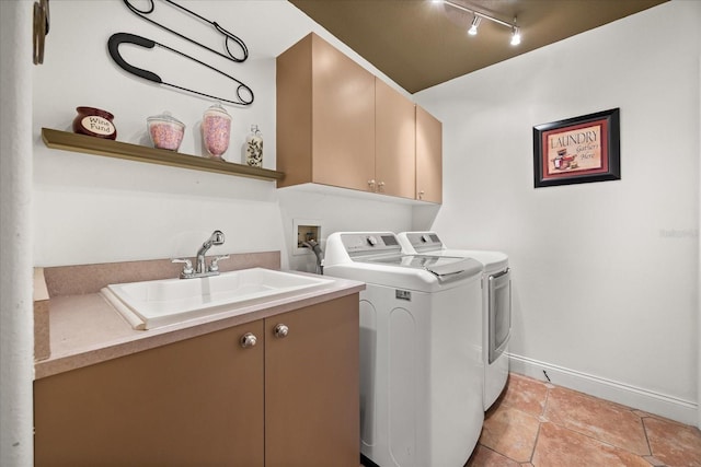 10664 Emerald Chase Dr, Orlando, FL 32836 - clothes washing area with baseboards, a sink, cabinet space, washer and clothes dryer, and light tile patterned flooring