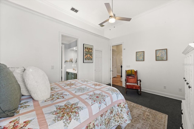10664 Emerald Chase Dr, Orlando, FL 32836 - bedroom featuring crown molding, ceiling fan, connected bathroom, visible vents, and baseboards