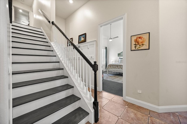10664 Emerald Chase Dr, Orlando, FL 32836 - staircase with tile patterned flooring, baseboards, and ceiling fan