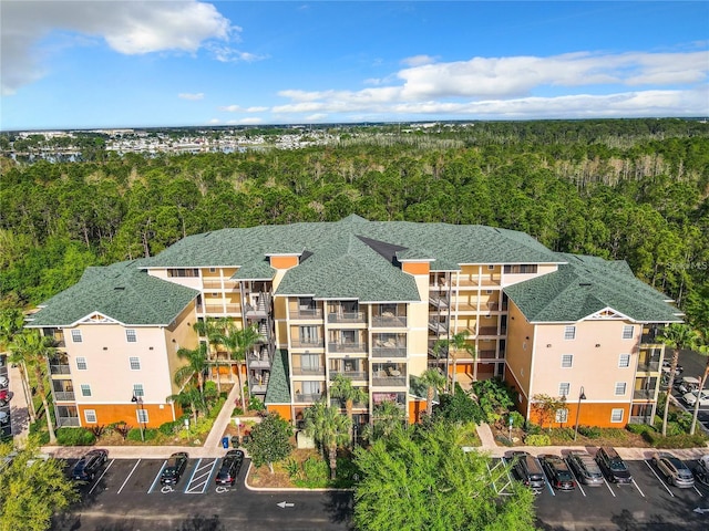 9051 Treasure Trove Ln Unit 405, Kissimmee, FL 34747 - drone / aerial view of a heavily wooded area and apartment complex