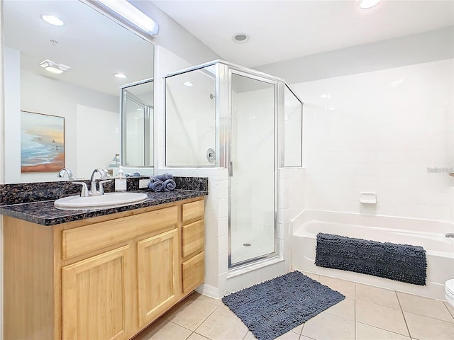 9051 Treasure Trove Ln Unit 405, Kissimmee, FL 34747 - full bath with a shower stall, tile patterned flooring, vanity, a tub to relax in, and recessed lighting