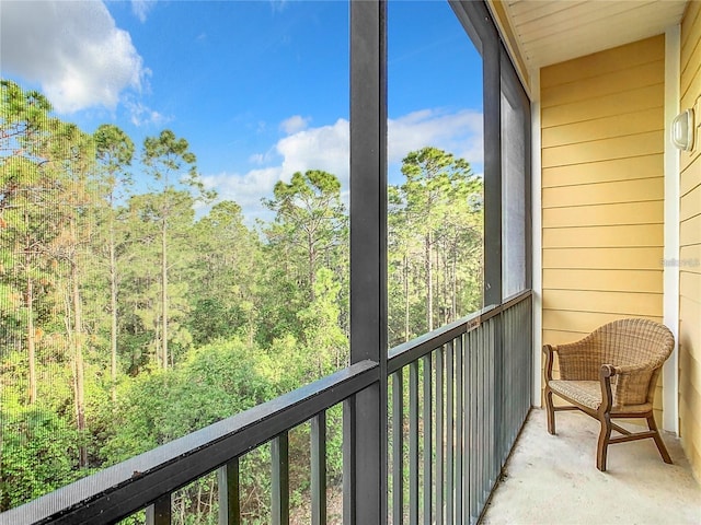 9051 Treasure Trove Ln Unit 405, Kissimmee, FL 34747 - balcony featuring a wooded view