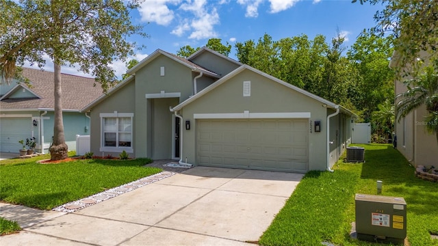 view of front facade with an attached garage, concrete driveway, stucco siding, and a front lawn