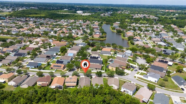 bird's eye view with a residential view and a water view
