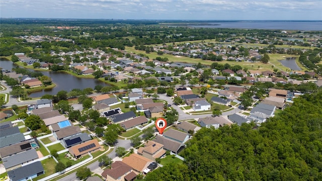 bird's eye view with a water view and a residential view